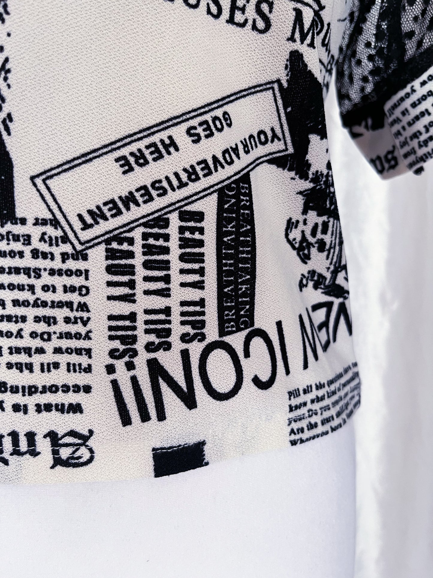 Iconic newspaper print top with lace sleeves 🕸️📰
