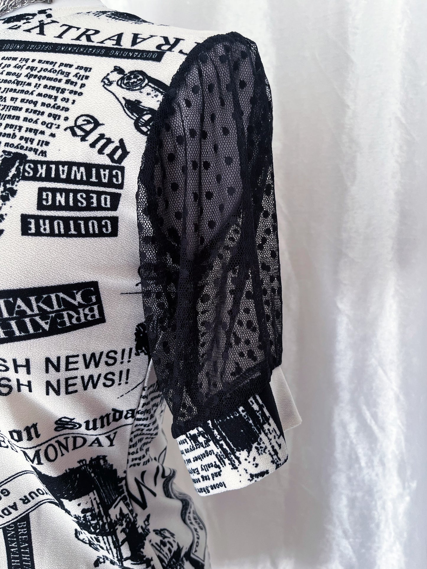 Iconic newspaper print top with lace sleeves 🕸️📰