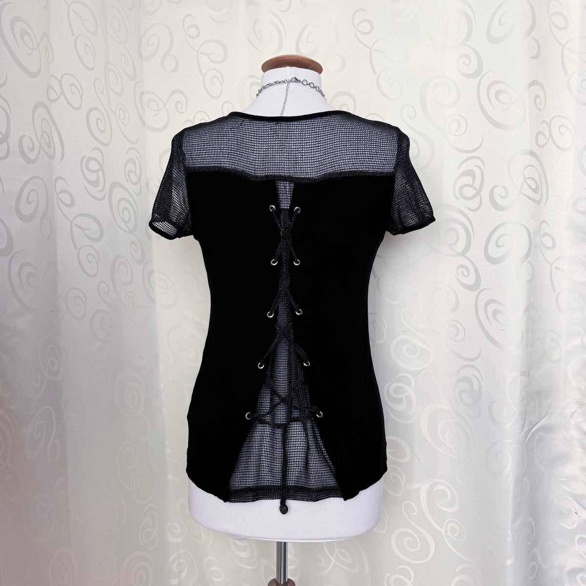 Alt Y2K style black graphic top with fishnet & lace up back 🦇🫀