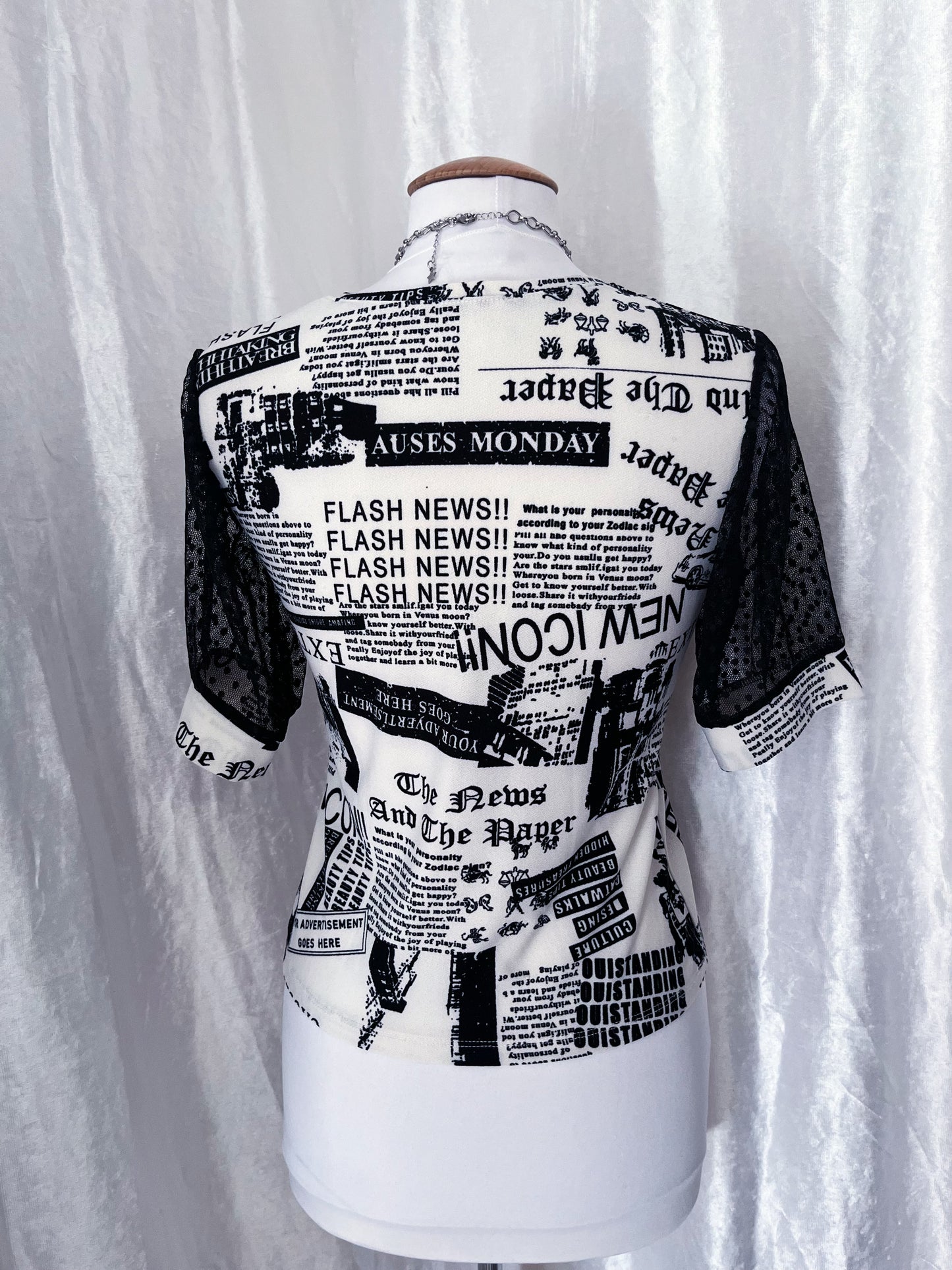 Iconic newspaper print top with lace sleeves 🕸️📰
