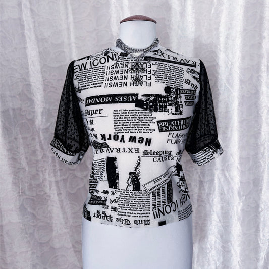 Iconic newspaper print top with lace sleeves 🕸️📰