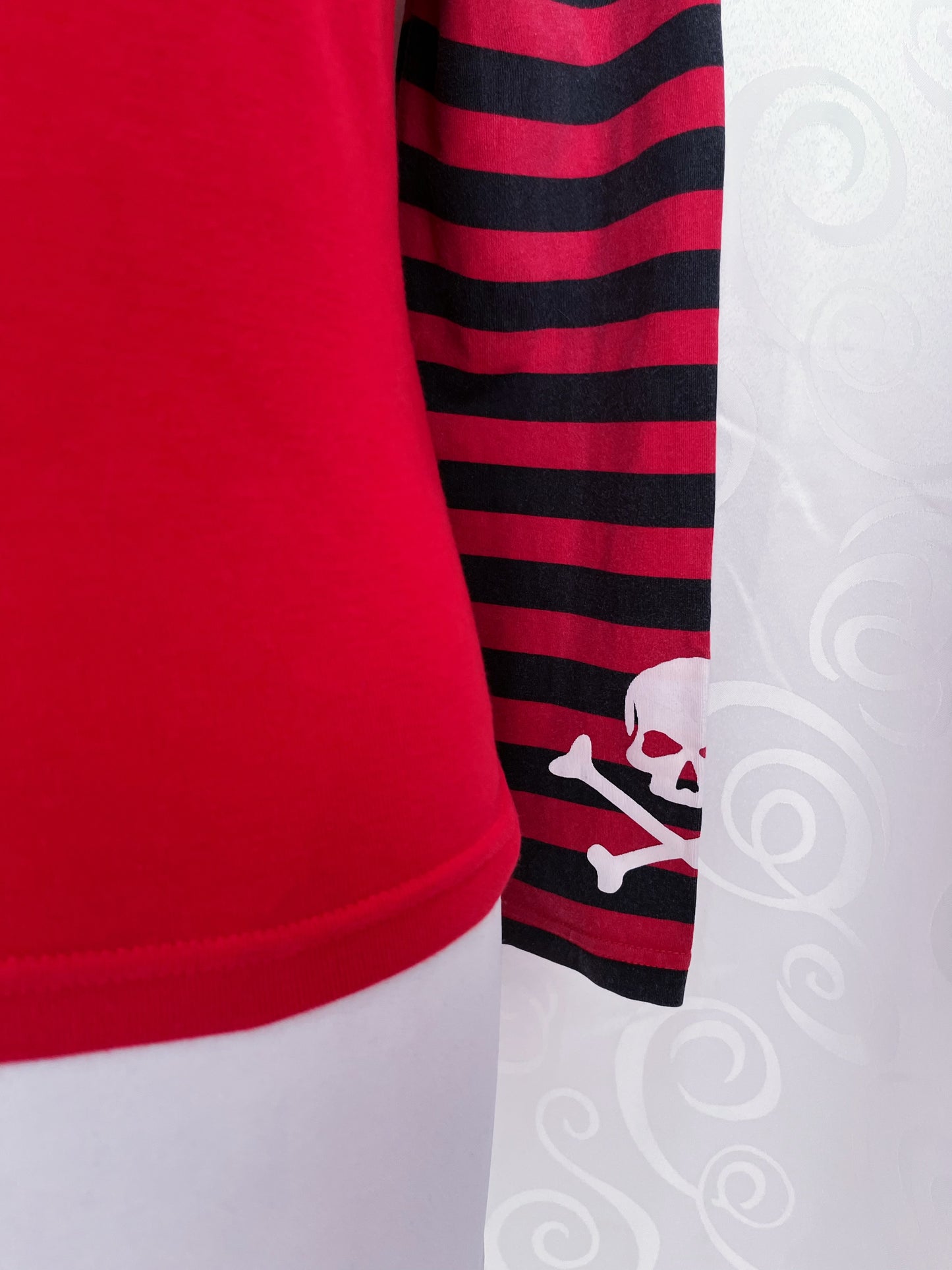 00’s emo red top with striped sleeves & skull prints on front & sleeves 💀☠️