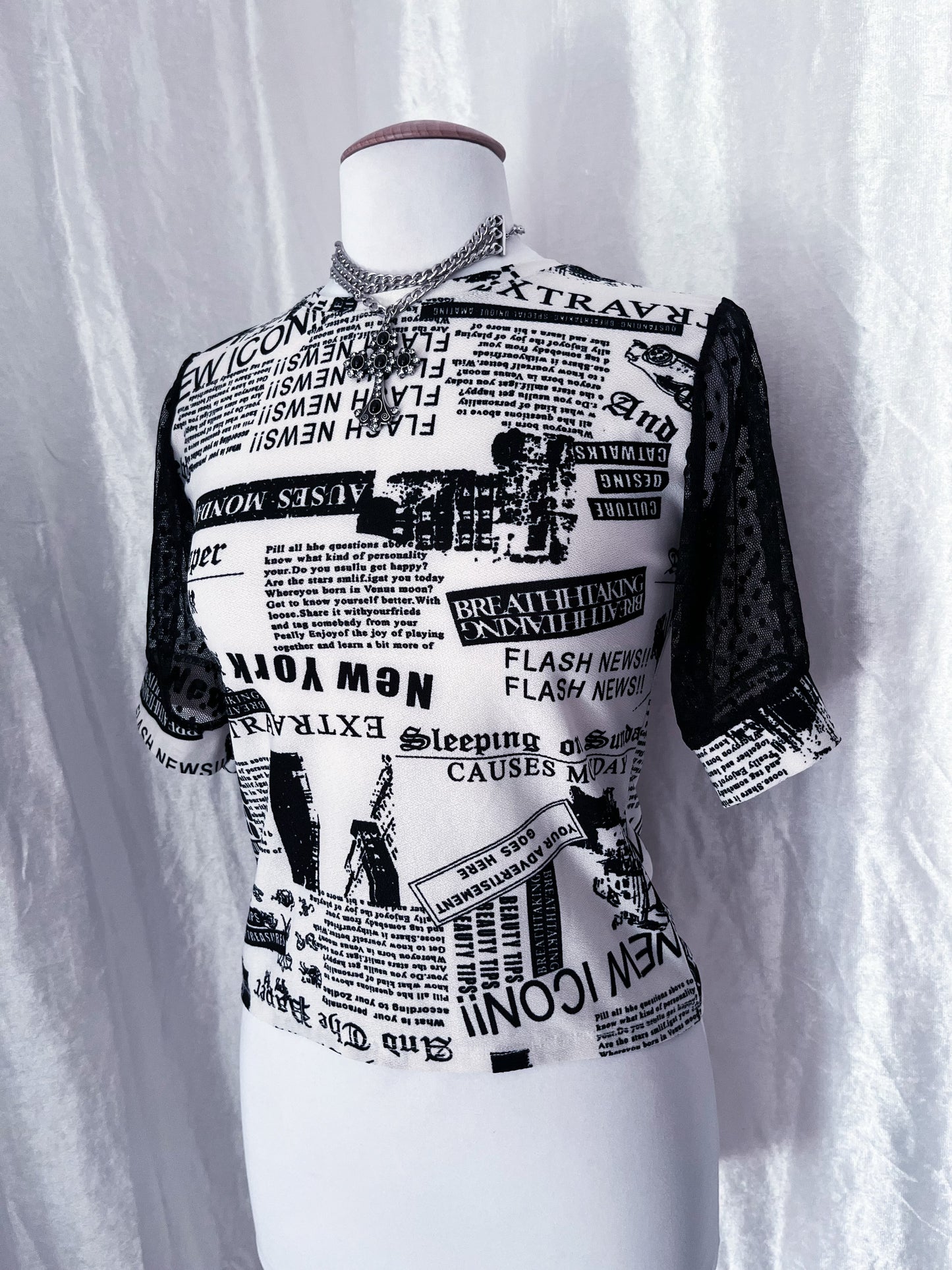 Iconic newspaper print top with lace sleeves 🕸️📰