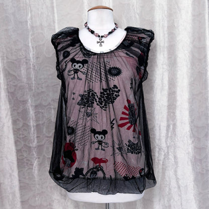 Twee 00’s top with cartoon & pop-culture print fabric with mesh layer on top 🐁🎪