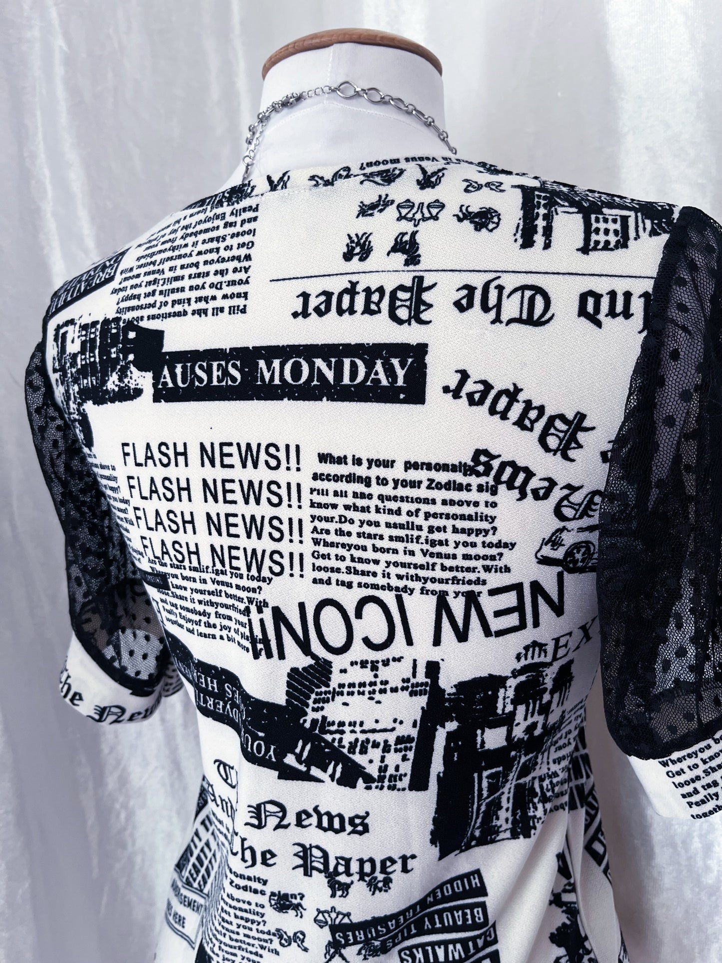 Iconic newspaper print top with lace sleeves 🕸️📰